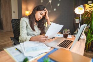 young woman worrying about student loan repayments